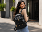 Woman carrying Uniqueonn GlamCarry Classic Black faux leather backpack for stylish everyday outings, college and casual use